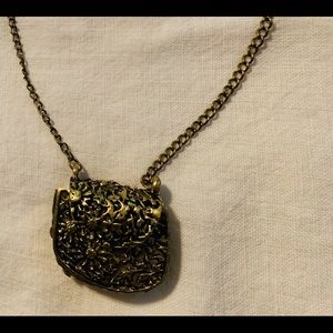 Bronzed colored purse necklace